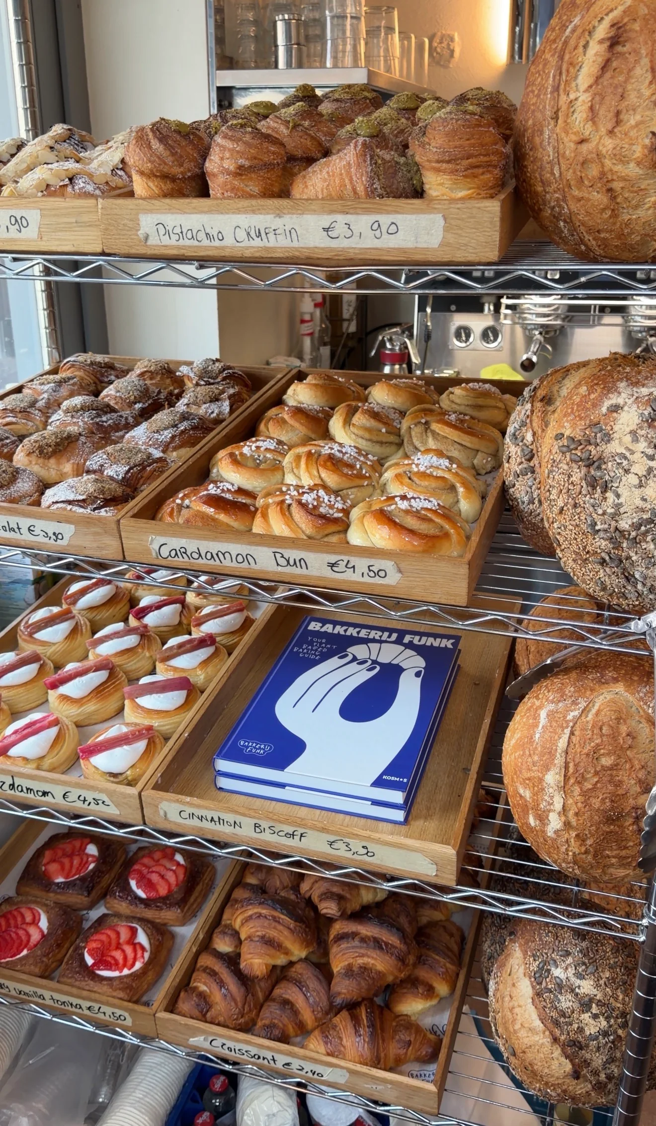 Trays of freshly baked FUNK pastries on the bakery shelf